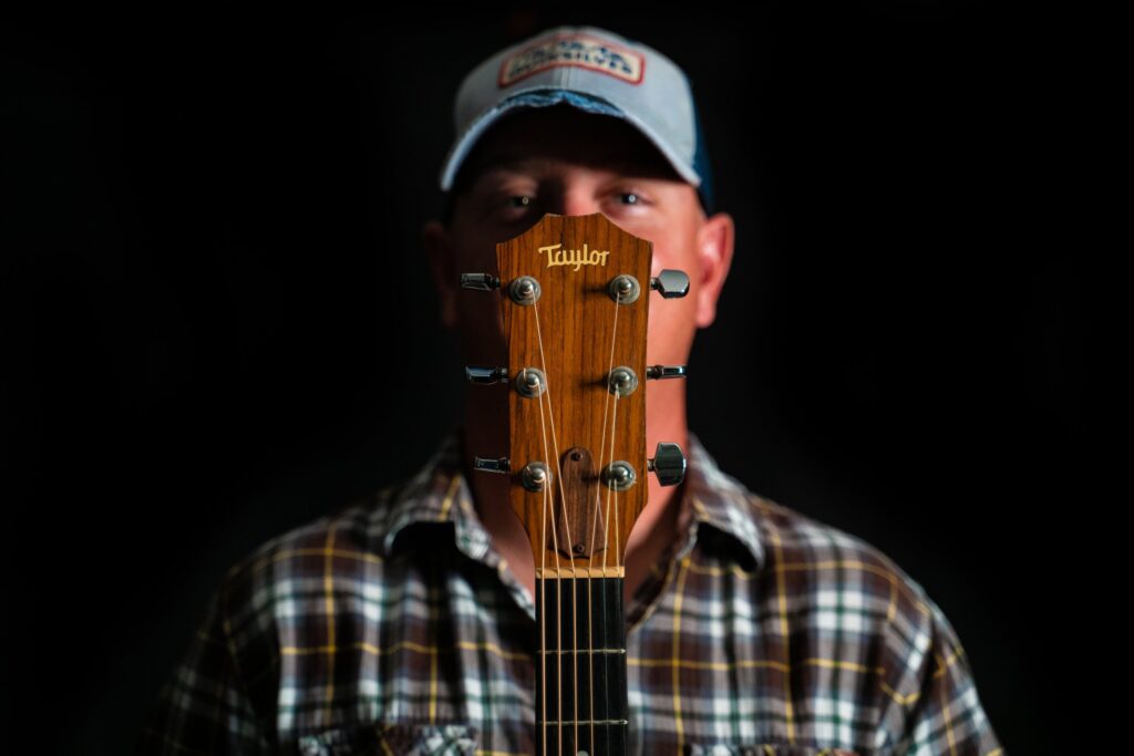 Jeff Lyons promo photo with guitar